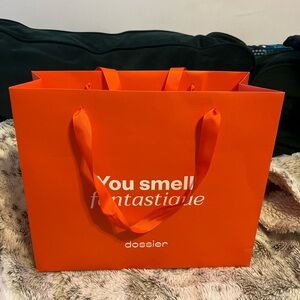 Dossier Orange Shopping Bag, 2 Perfume Testers, and a Tote Bag